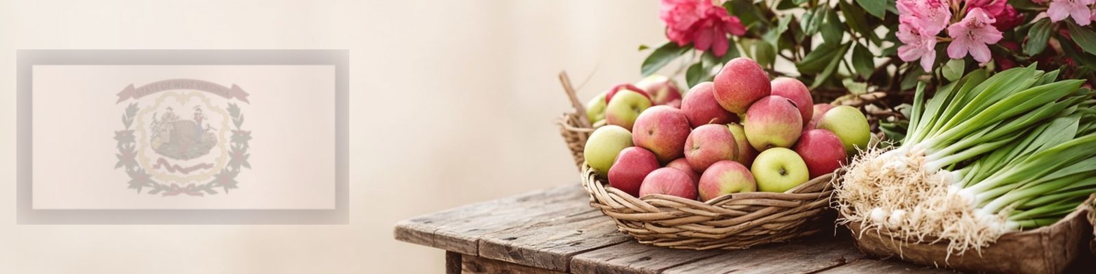 Faded West Virginia flag beside apples and green onions on a farm stand with rhododendrons, the state flower.