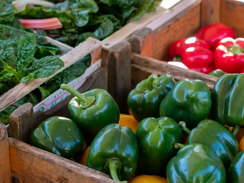 Bell peppers in rustic wooden crates